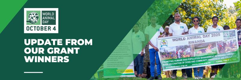 Members of the Rwanda Animal Welfare Organisation (RAWO) holding a World Animal Day 2025 banner promoting humane dog population management and vaccination in Rwanda.
